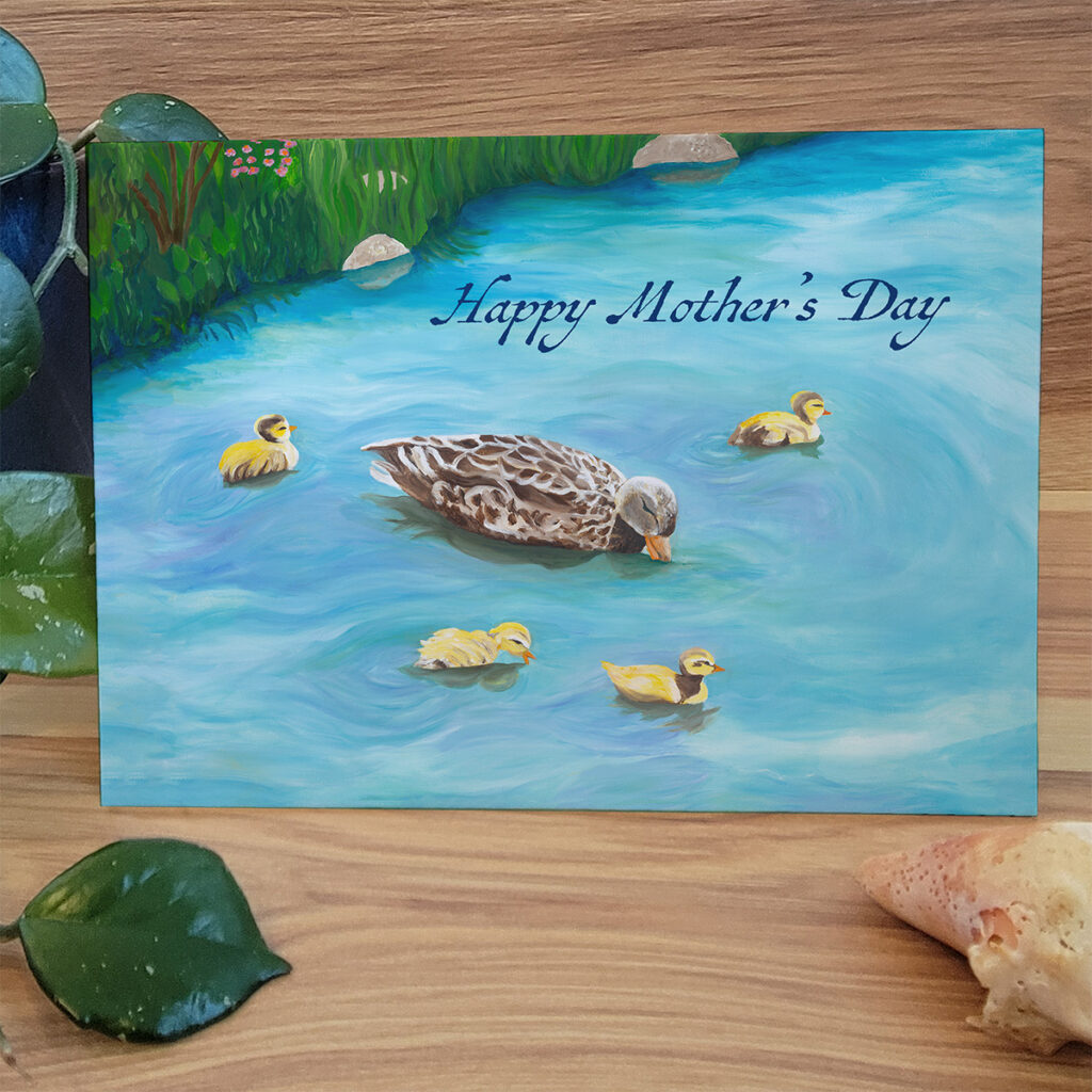 Serene scene of a mother duck surrounded by her ducks in a pond. Text "Happy Mother's Day".