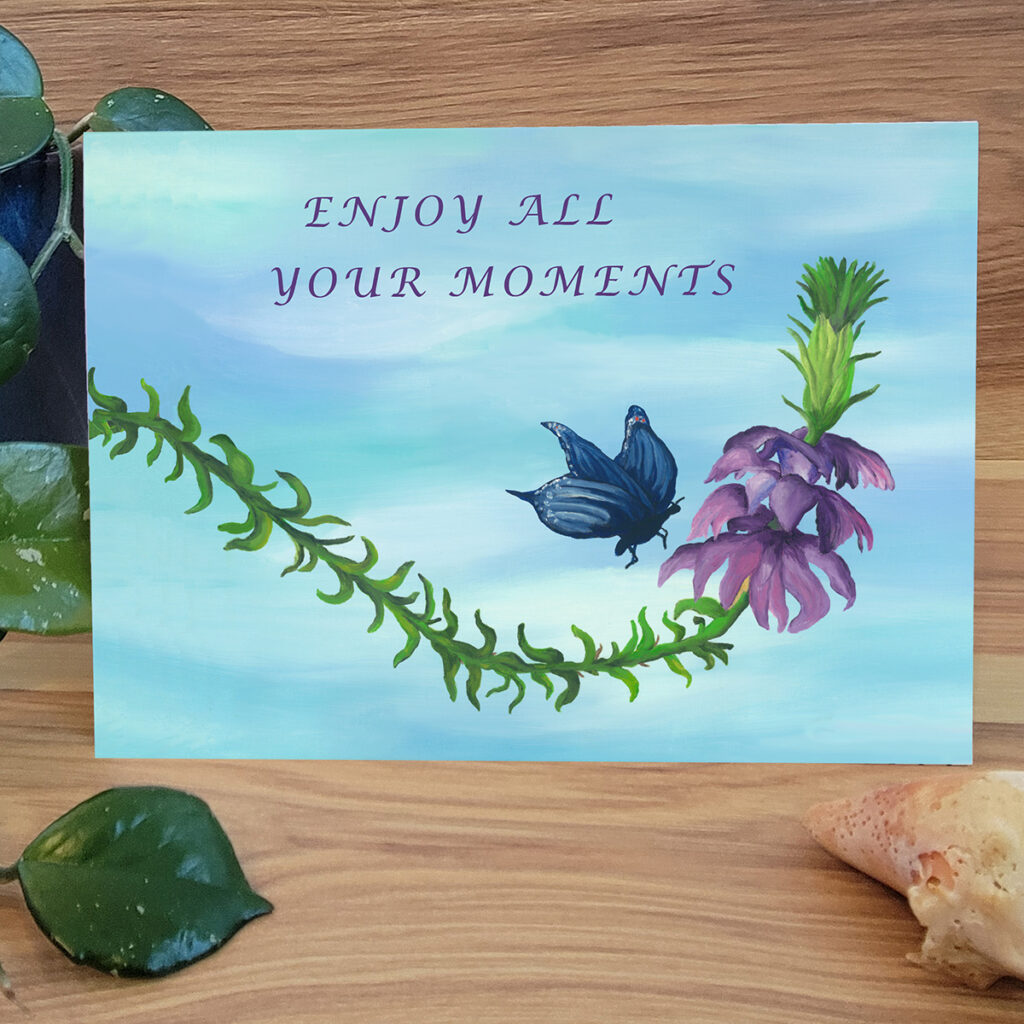 Butterfly pollinating purple flower Card. Says "Enjoy All Your Moments"