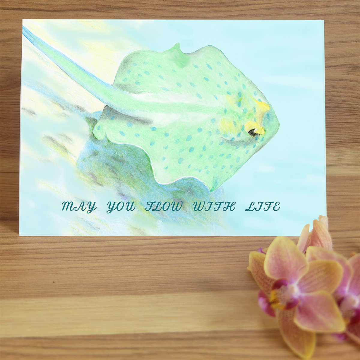 Hand drawn round fish swimming. Text "May You Flow with Life".